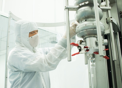 Researcher testing an SRF cavity
